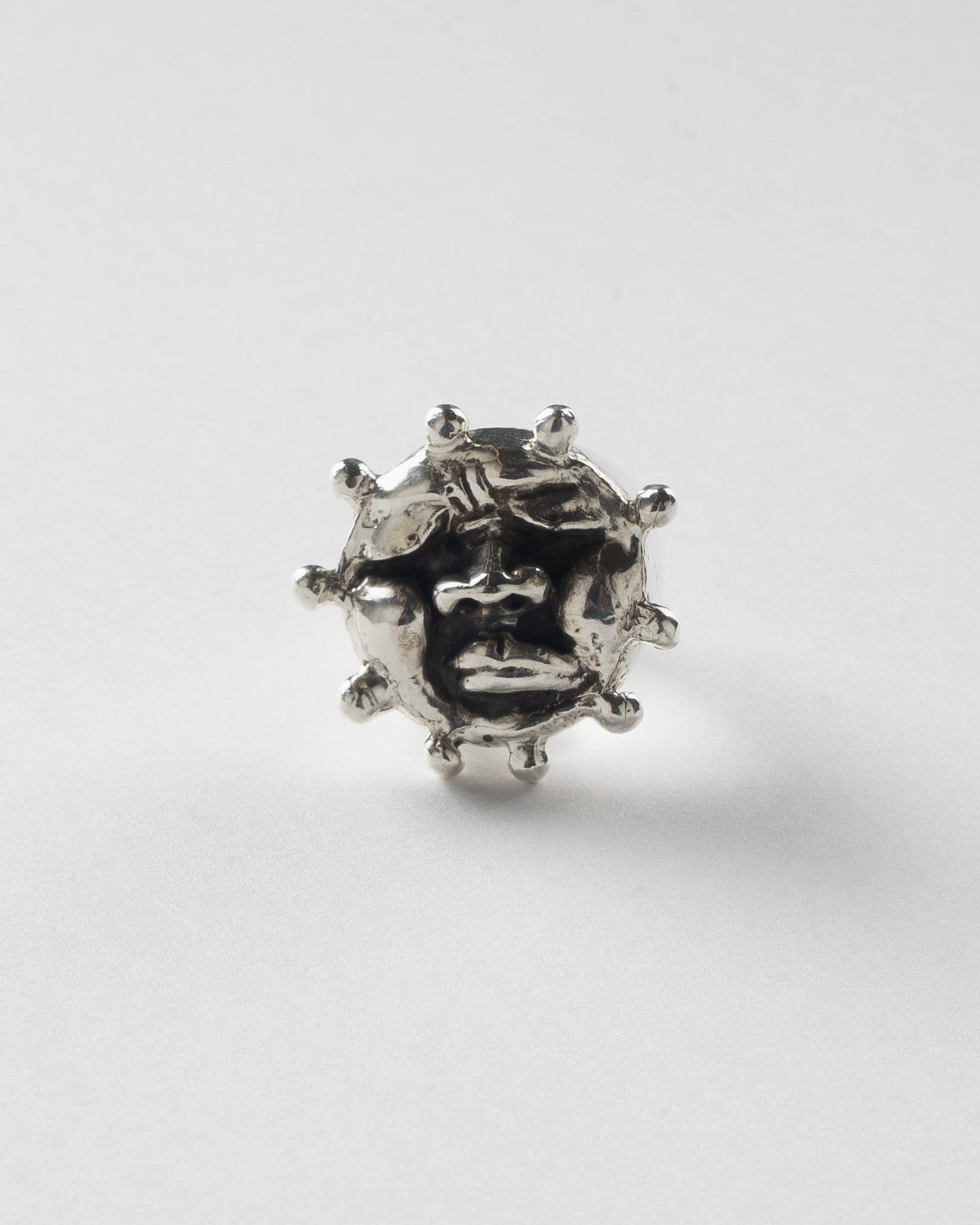 Helios, Silver sun face ring